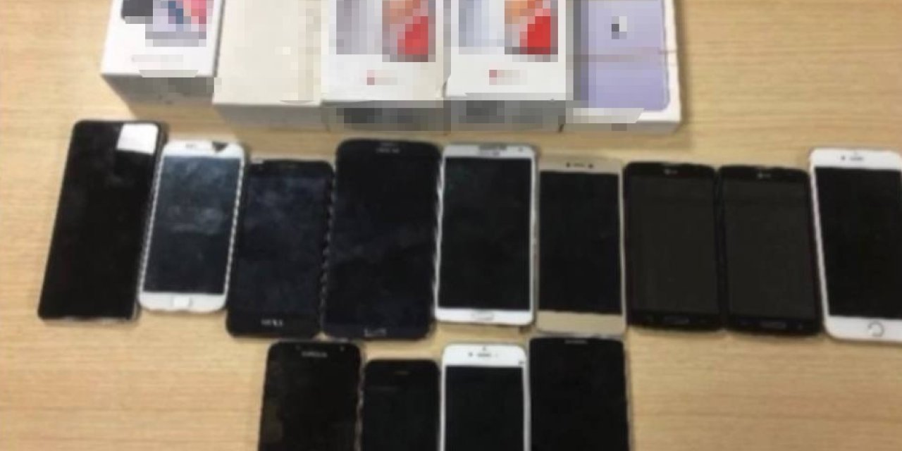 Duvarı delip, 1 milyon liralık cep telefonu çaldılar