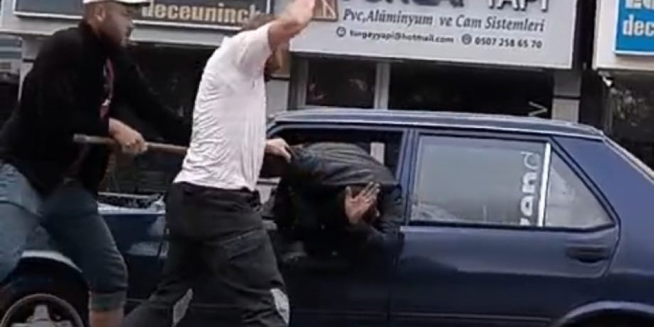 Trafik magandaları bir sürcüyü aracın camından çıkartıp dövdü